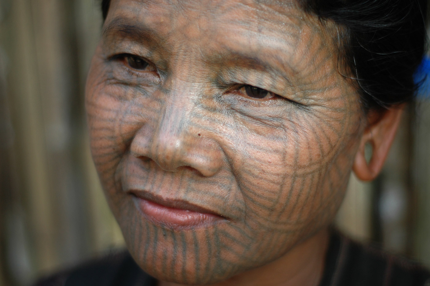 The tattooing tradition might have been started by parents wanting to scare wild animals away from the tribe's girls or even discourage the king of ancient times to take the prettiest girls into his harem, Chin State, Western Myanmar, 2005 