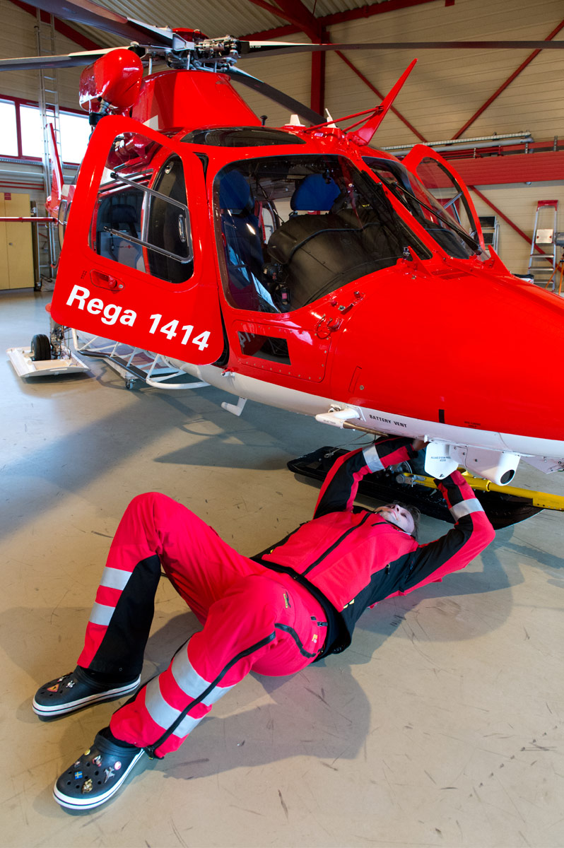 Pilot checking Helicopter, Rega Base St. Gallen, St. Gallen (SG), 2013