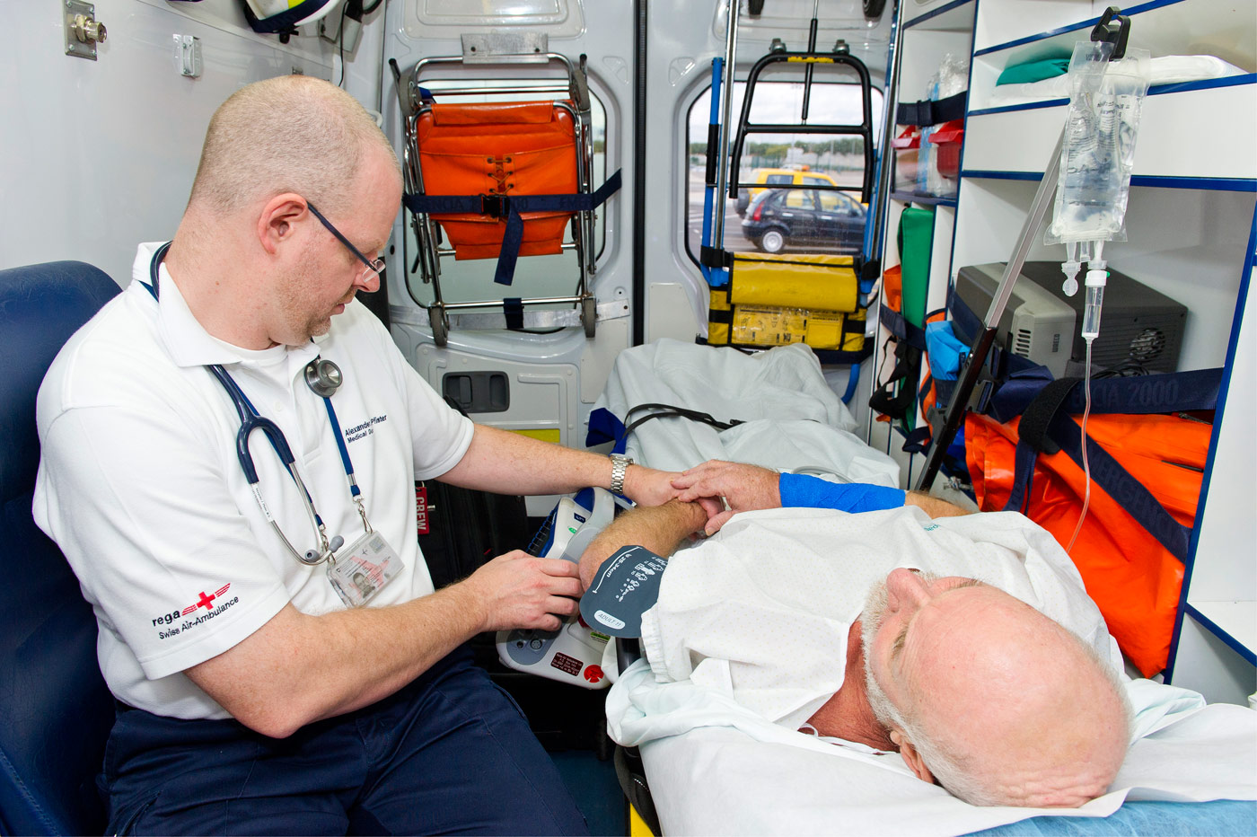 Rega Flight Physician supervises his patient with craniocerebral injury in the ambulance, Palma de Mallorca, Spain, 2012
